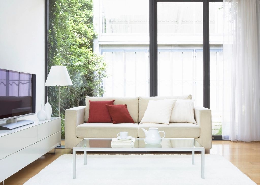 A suite sitting room with a sofa and armchairs